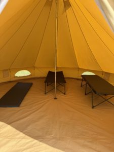 Inside bell tent with camp beds